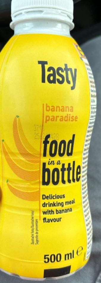 Fotografie - Tasty banana paradise food in a bottle